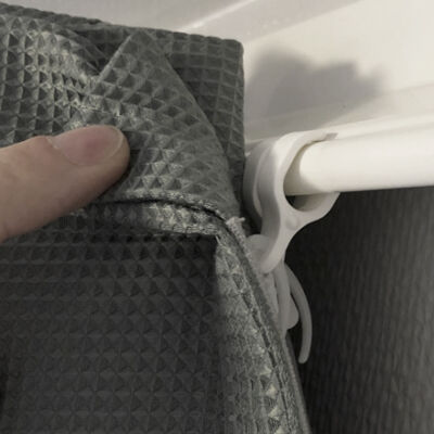 Close-up of curtain and runner attached to suicide preventive J-trac curtain rail system