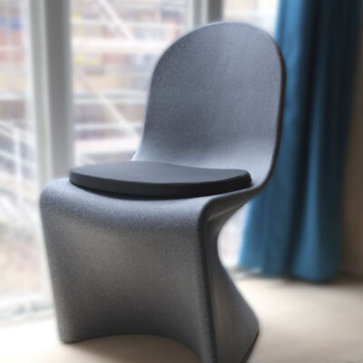 A granite coloured Ryno dining chair with seat cushion