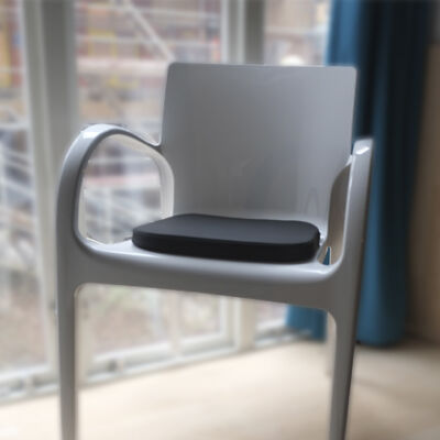 a white Xeon chair with seat cushion