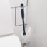 Flexible toilet brush with wall mounted container