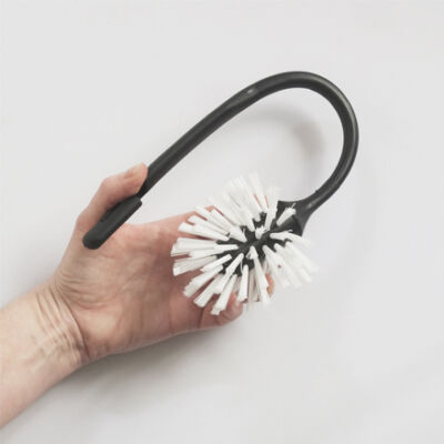 hand that bends flexible toilet brush without breaking