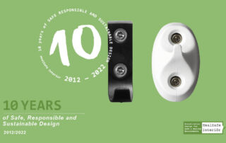 One black and a white towel hook creating the nr 10 and text
