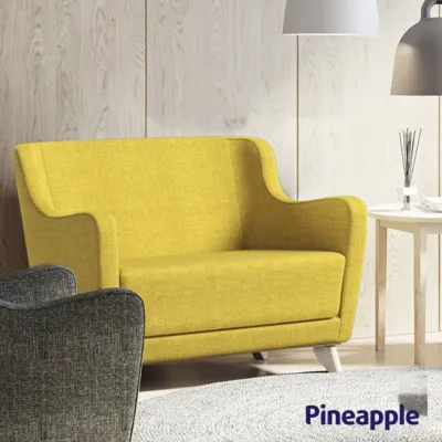 Purl PLUS armchair and 2-seater in a bright room